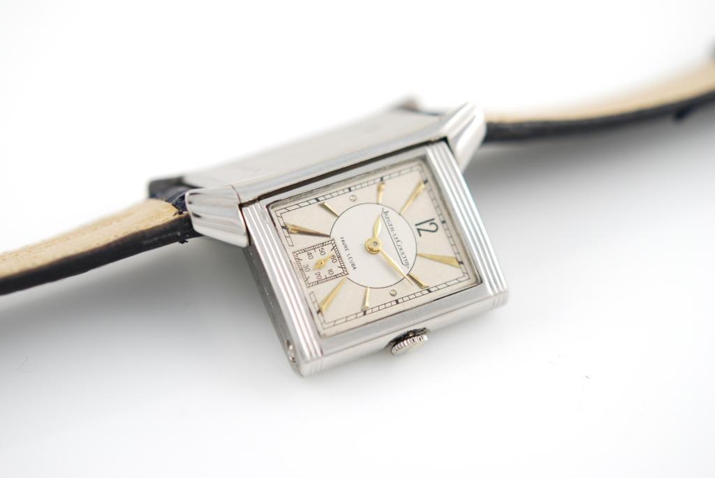 Jaeger-LeCoultre stainless steel manual-wind Reverso wristwatch with leather strap. The dial is silvered with gilt dagger indexes and subsidiary seconds and is further signed Favre Leuba.