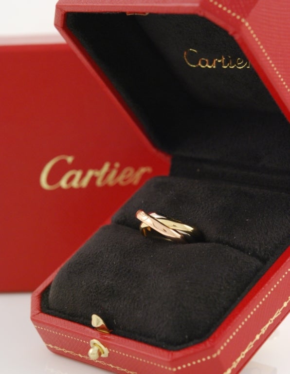 Cartier Trinity ring in yellow, white and pink 18kt gold. The ring comes with Cartier original box. Size 5