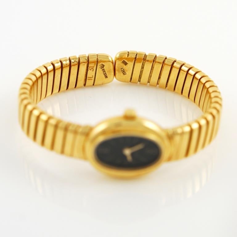 18k yellow gold Tubogas  bracelet watch by Bulgari, circa 1970s. Black dial, sapphire crystal, manual-wind mechanical movement.