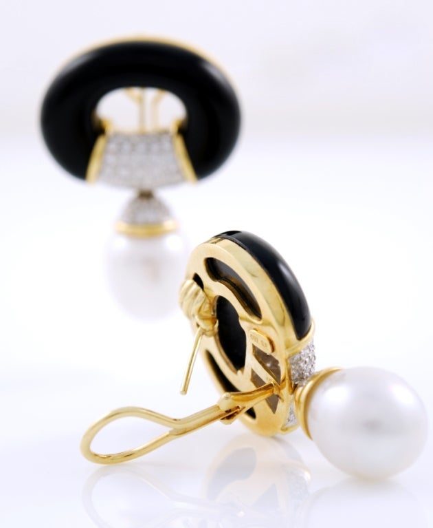 Beautiful onyx, diamond and Australian pearl earrings set in 18kt yellow gold. Diamonds are approximately 2,5 carats. The earrings can be used clip-on or with the posts.