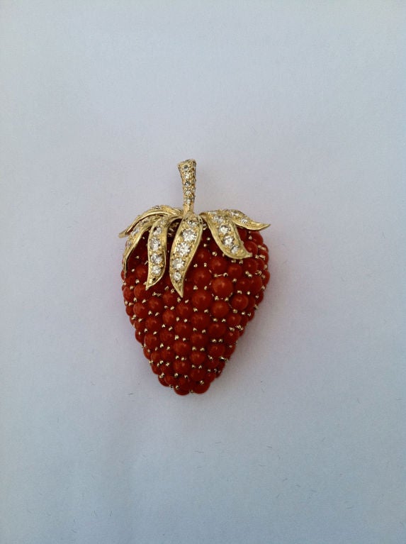 Fine & rare vintage Tiffany & Co. 18K, diamond & coral 'strawberry' brooch. Authentic signed item designed by Jean Schlumberger with French hallmarks. Outstanding design & execution. Yellow gold item with diamond (approx. .75tdw) set stem & coral