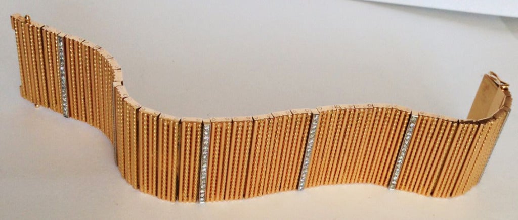 A exquisite Marvin Schluger retro cuff bracelet. 18K rose gold articulated link item features six rows of pave set diamonds (approx. 1.02ctw single cut G VS). Hidden push clasp closure with double locks intact. Unsigned.