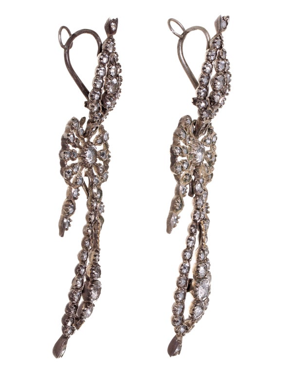 Portuguese white paste earrings set in silver with original ear wires. The pendeloque came into fashion because its elongated outline counterbalanced the extreme height of hairstyles around the 1770's. See a similar pair at the Victoria Albert