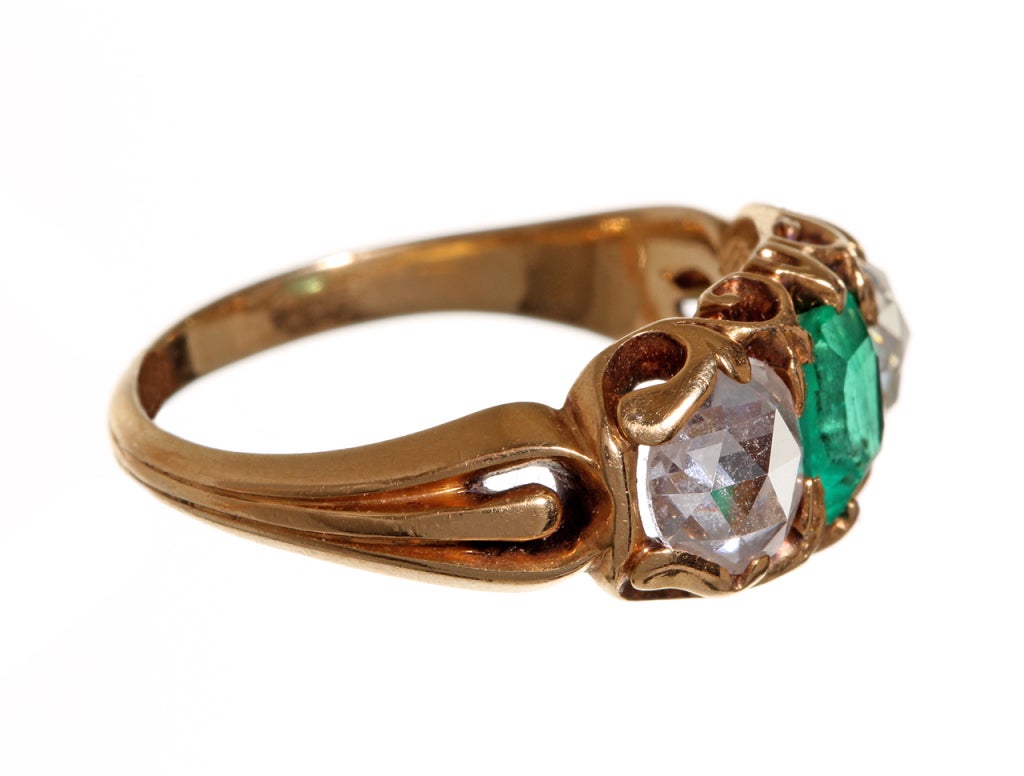Late 19th century rose cut diamond and emerald ring in 18k gold.
Found In England. Size 6.5 , can be easily sized. Shown on model with antique diamond band (sold).