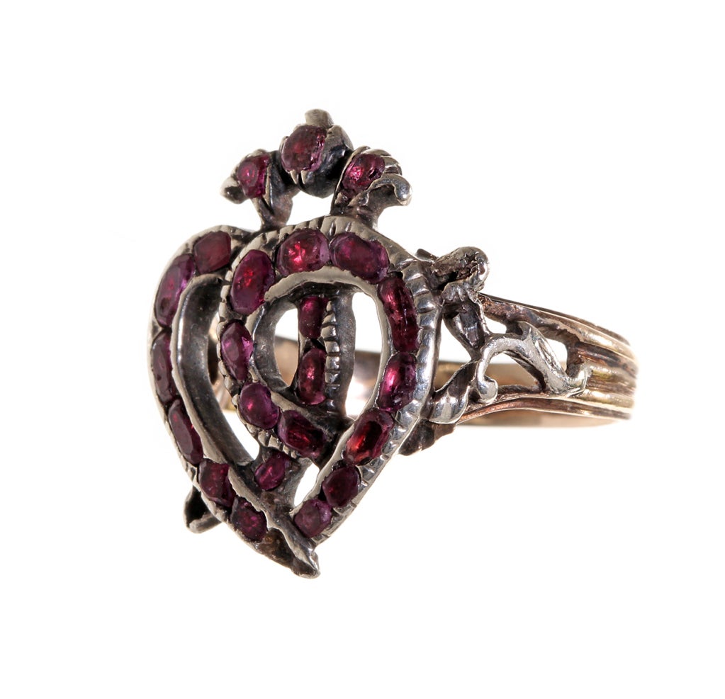 18th century Luckenbooth ring.  Garnets set in silver on gold shank. The luckenbooth is a Scottish symbol for marriage.  Used throughout the 16th to 18th century as a love token. Size 6, can be sized. Shown on model with her own 1807 mourning ring
