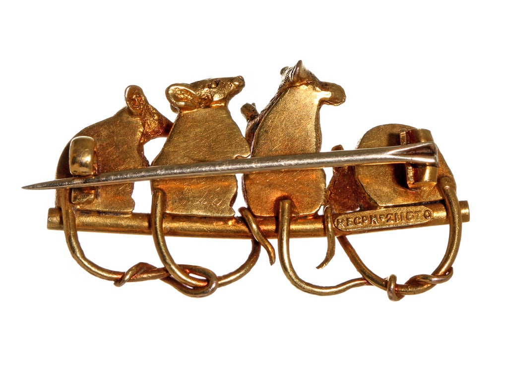 Amusing English Victorian era pin in high carat Gold. 4 curious mice, all with rose cut diamond eyes, sit together with their tails intertwined. These unlikely subjects for jewelry were often given as lucky charms.

The brooch remains in its