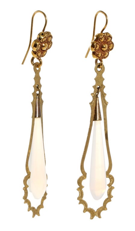 Great example of torpedo drop earrings from the 1830's & 1840's. Their size and lightness were dictated by fashion. The horizontal lines of style of dress and hair needed to be offset by long pendants. While at the same time the scarcity of precious
