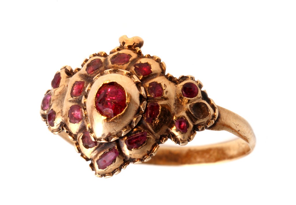 Flat cut garnets set in 18k gold form the shape of a 'witches heart'.
The witches heart was a romantic symbol of 