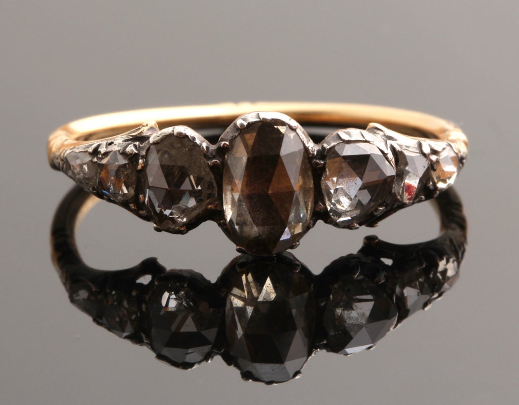 Oval rose cut graduated diamonds set in sterling with 18k gold shank. Size 6.5, can be easily sized. Pictured on model with: our Georgian Rose Cut Diamond Ring and Early 19th Century Mine Cut Diamond Ring.