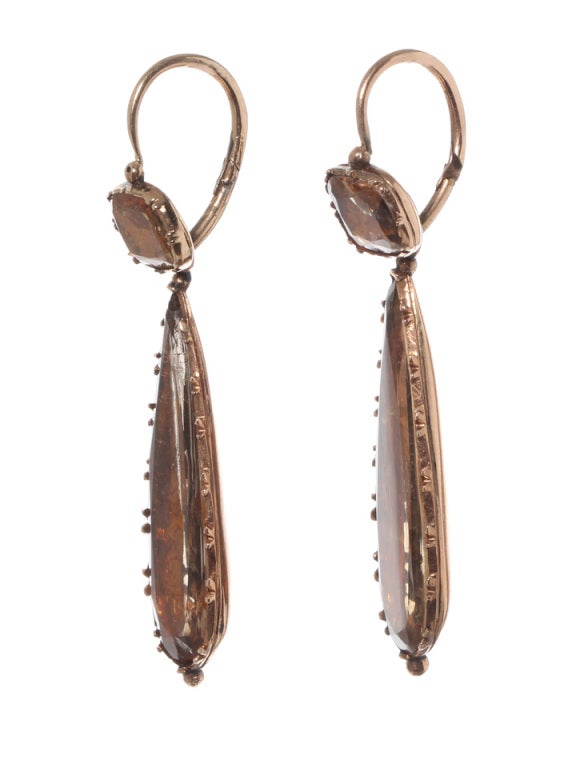 Day-to-night gorgeous foiled rock crystal earrings set in 18k gold with closed back setting. Back to front ear closures are hinged at back. Approximate 2