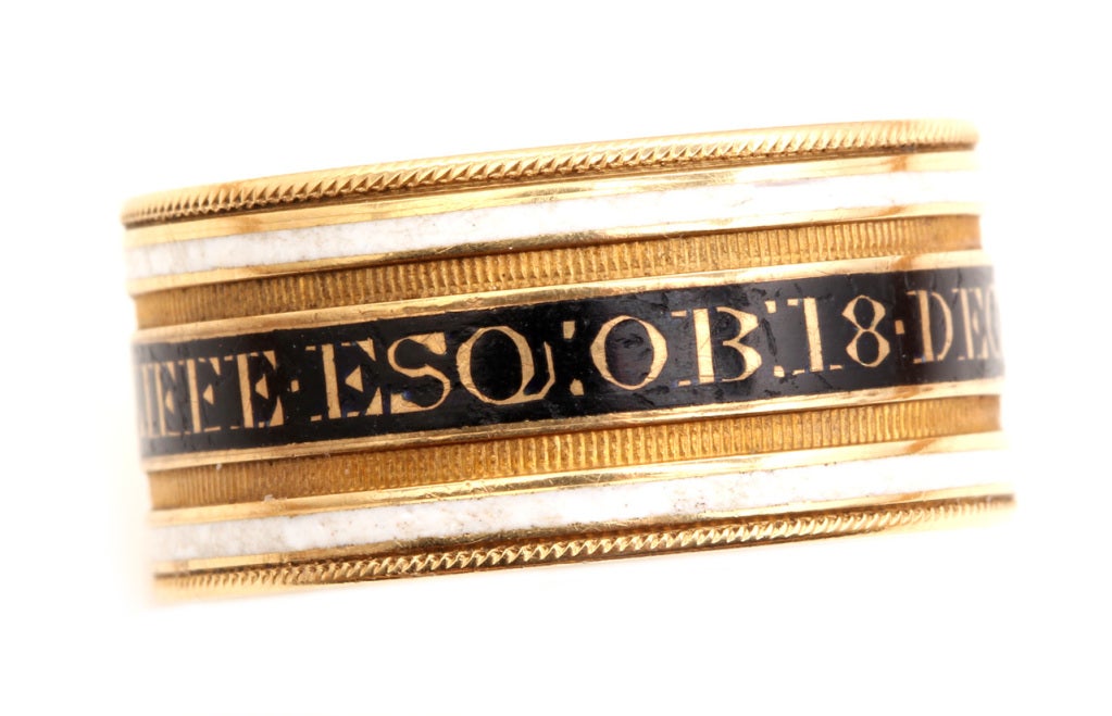 English 1817 remembrance ring in 18k gold and enamel. Reads: CHA's RADCLIFFE ESQ  OB: 18 DEC 1817 AE:78.
This ring is memory of Charles Radcliffe who passed away on December 18, 1817 at the age of 78. The white enamel on the ring symbolized that