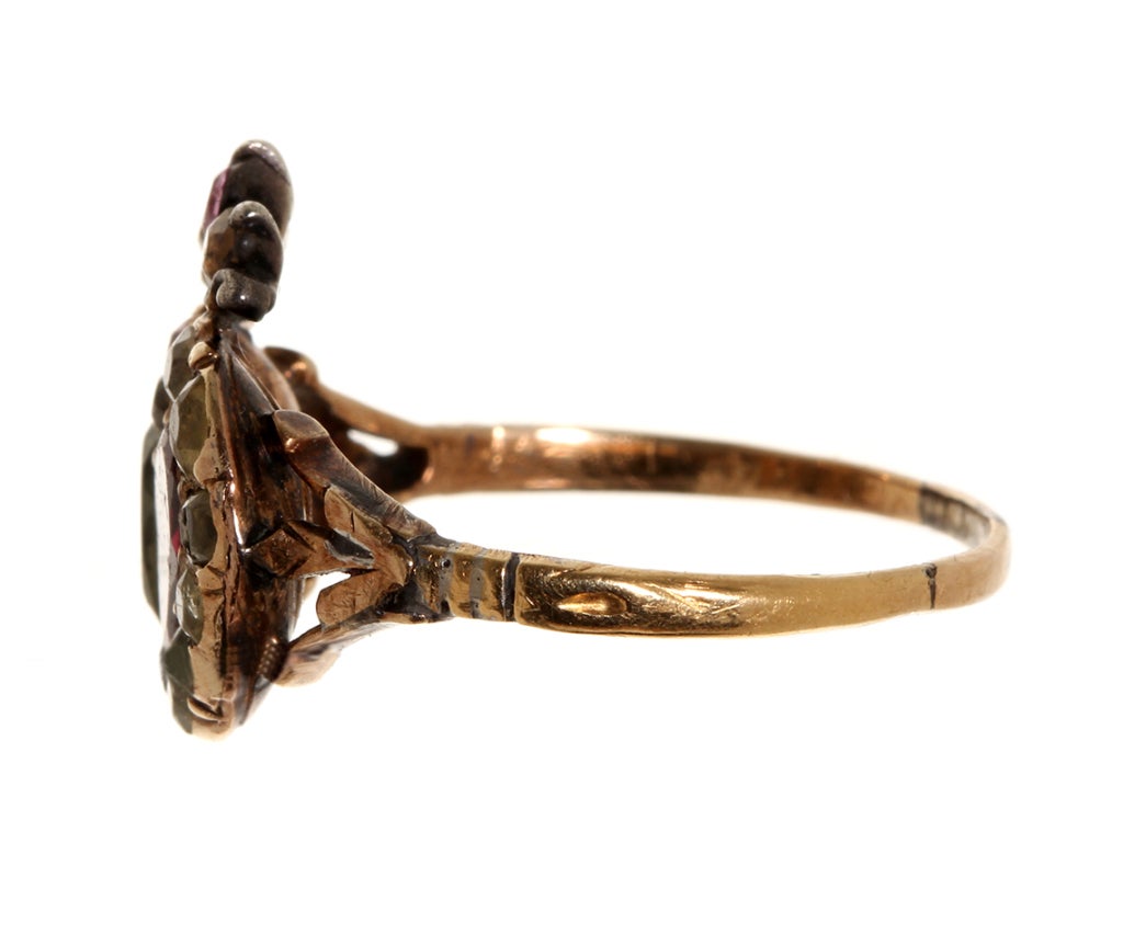 Georgian era crowned twin heart ring. Varying shades of chrysoberyl and garnet stones set in rose gold.  Twin hearts and crown a symbol for loyalty and love. Beautiful closed back settings with reeded detail on reverse. Size 6.75, can be sized.