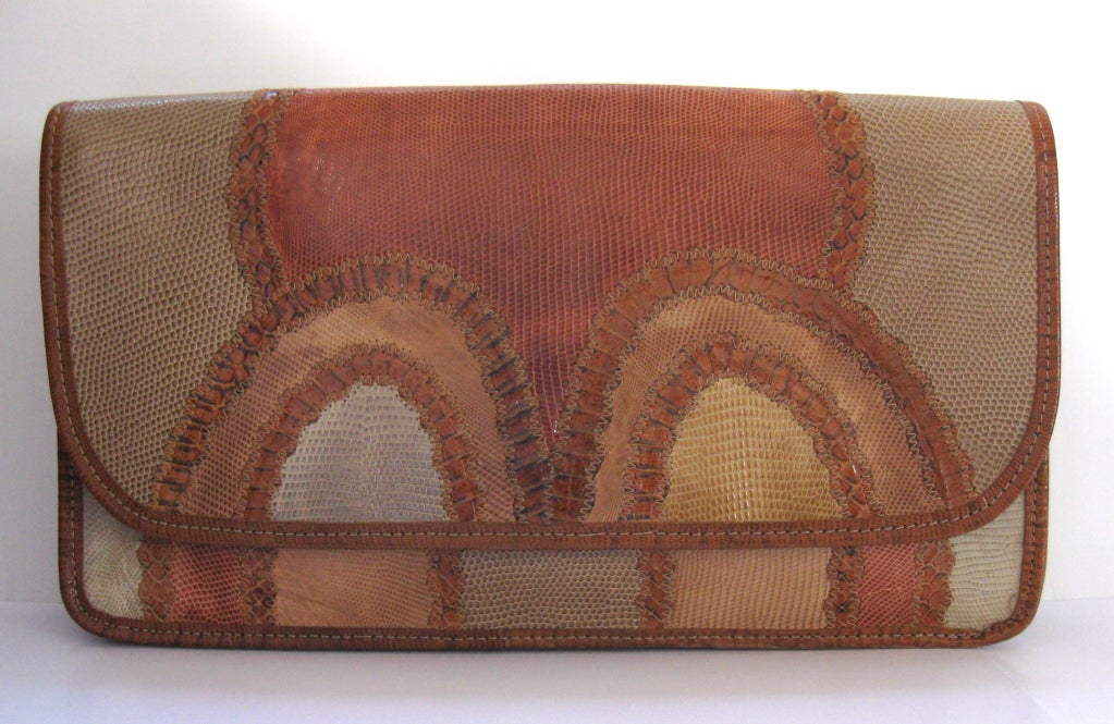 Carlos Falchi's signature envelope clutch bag, in snakeskin, lizard and embossed leather, circa 1980's.   Flap closure with a hidden single snap and interior pocket,
Wonderful color palette, featuring shades of beige, cream and peach.
VIEW BY