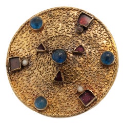 Disc Brooch Ornamented With Filigree, Garnet, And Glass