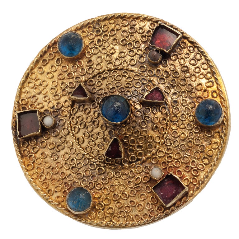 Disc Brooch Ornamented With Filigree, Garnet, And Glass For Sale