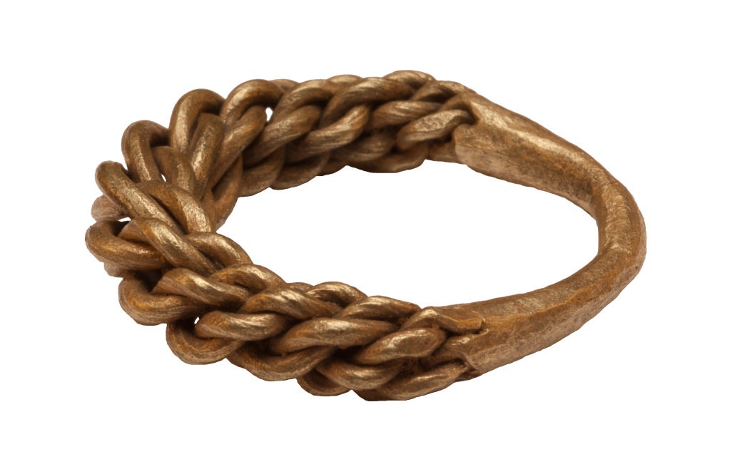 This gold ring, its hoop made of wires plaited together, is typical of Viking jewelry. Almost all these rings are large in size, an indication that they were probably worn by men. Decorative rings made in England and Scandinavia between the 9th and