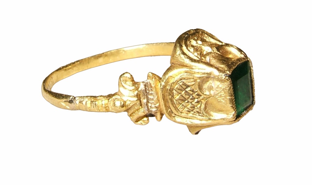 gold and emerald

Bezel 6 x 11 x 11 mm.; circumference 57 mm.; weight 3.5 gr.; US size 8; UK size P ½


In a closed box setting, the precious emerald of this fashionable ring glitters brightly, reflecting the foil underneath it.  The intricate