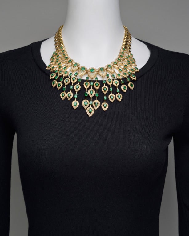 Emerald and diamond pear-shaped drop fringe necklace, set with 93 oval-shaped emeralds weighing approximately 34.27 total carats and 1,524 round diamond accents weighing approximately 15.24 total carats, mounted in 14k yellow gold.