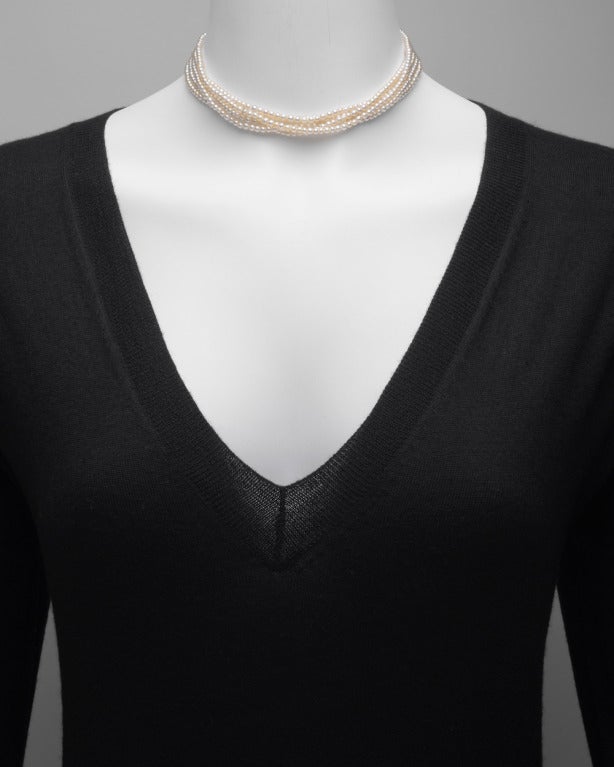 5-strand natural pearl choker necklace, the pearls ranging from approximately 2.85mm to 3.60mm, with pierced diamond-set clasp in platinum, circa 1920 (recently, re-strung by Betteridge with the antique diamond clasp). Accompanied by GIA