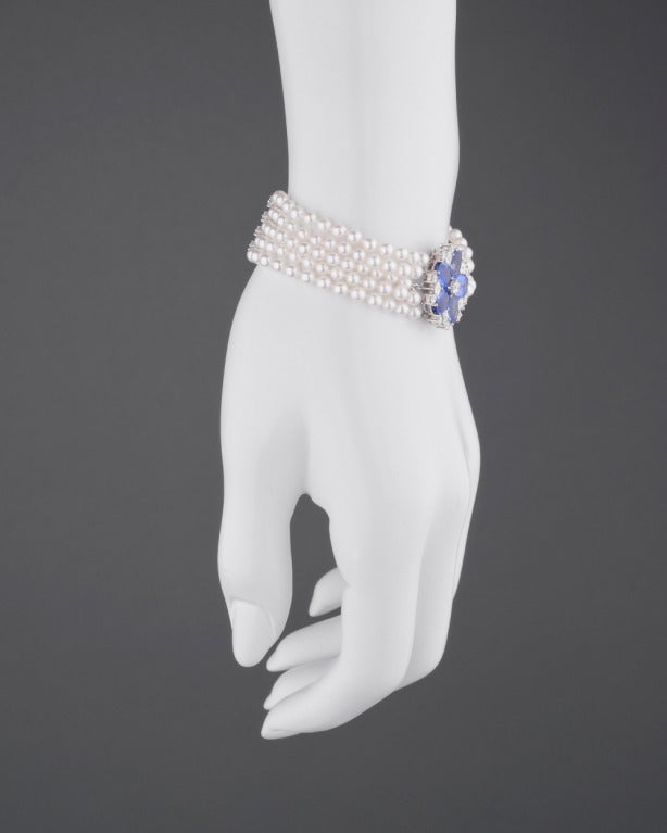 5-strand cultured pearl bracelet, with two platinum and diamond bar dividers accented by 0.45 total carats of diamonds, as well as a 'Snowflake' motif sapphire and diamond clasp, with five pear-shaped sapphires weighing 7.20 total carats and