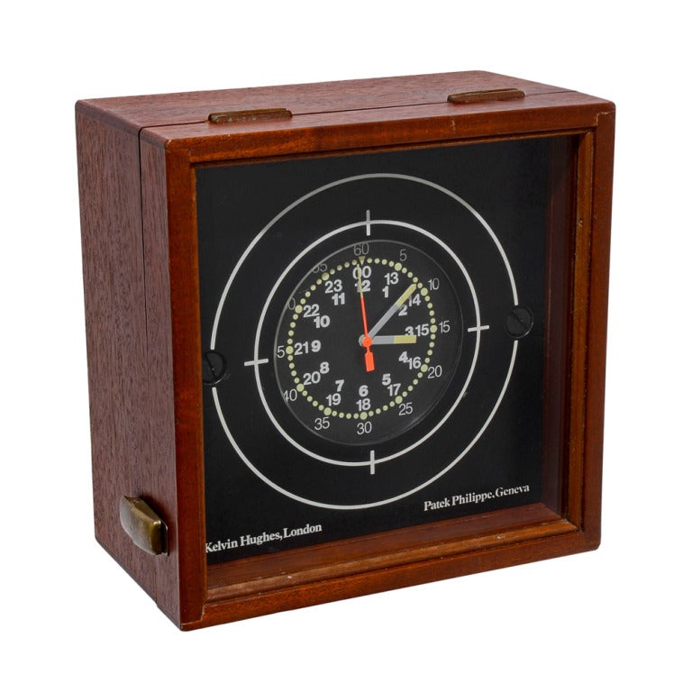Patek Philippe Marine Chronometer Clock, retailed by Kelvin Hughes, London, featuring a quartz movement, black matte dial with Arabic five minute numerals, 24 hours and 12 hours indicators and luminous baton hands, center seconds, 7.25
