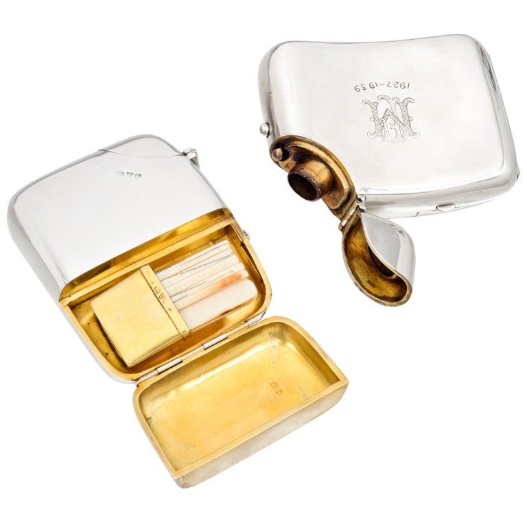 Pair of matching Victorian, sportsman sterling silver flasks, one opening to reveal a fly fishing lure box and the other opening to reveal a set of grouse butt markers, the fronts engraved with initials and '1927-1939'. Made in England, circa 1897.