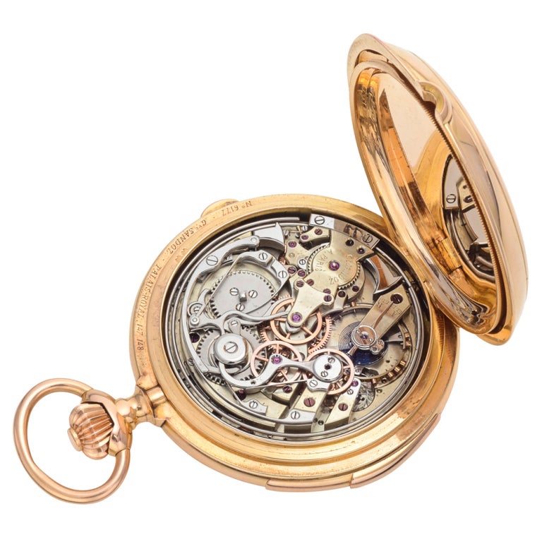 Sandoz Grand Complication pocket watch, featuring a mechanical manual winding movement; white dial with black Roman numerals and minute track; perpetual calendar with date display at 3 o'clock, month display at 9 o'clock, and day-of-the-week display