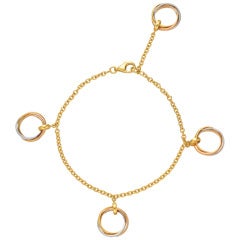 CARTIER Gold "Trinity" Rolling Ring Charm Bracelet