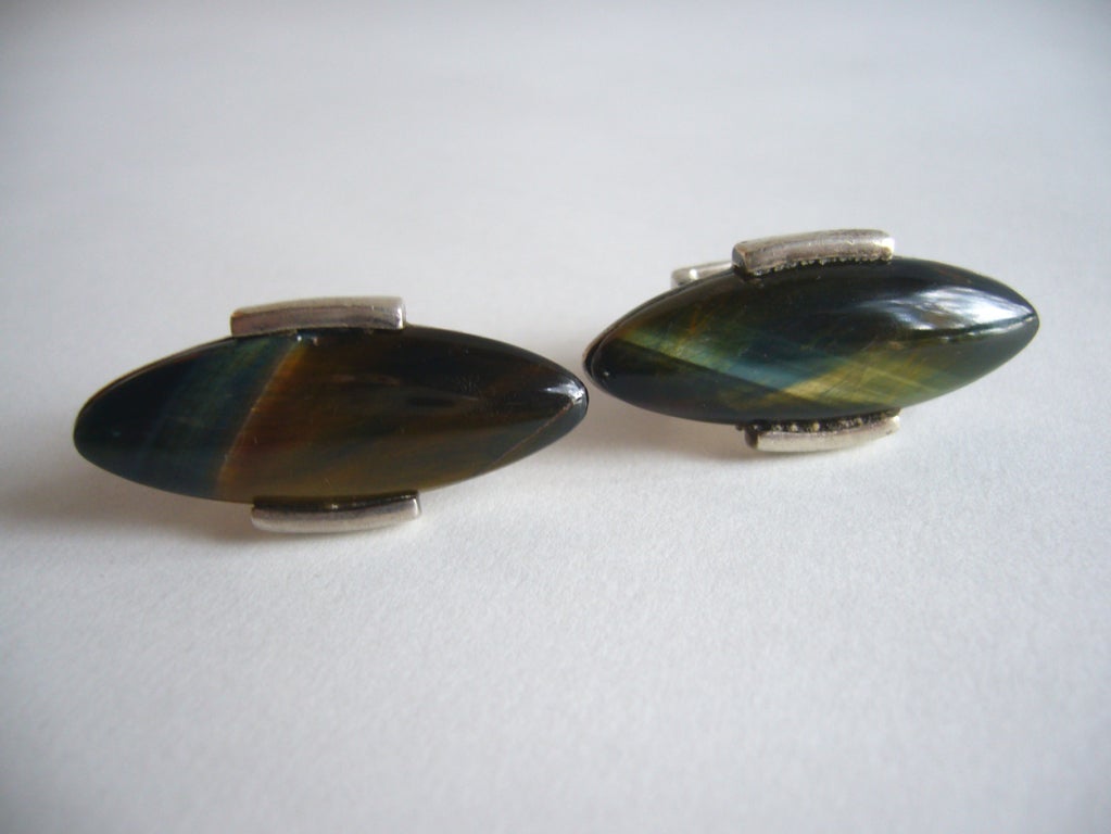 A beautiful pair of stone cufflinks from Mexico circa 1960.  Featuring large iridescent high polished, natural stones which measure 1 1/2