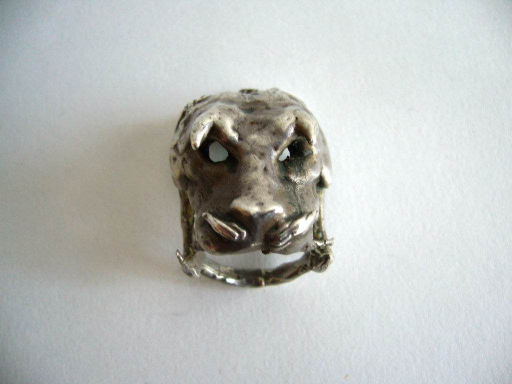 A handmade, one of a kind sterling silver demonic boars head ring created by Cuban born Ernesto Gonzalez Jerez.   Ernesto came to the United States in 1947 and quickly became known for his oxy-acetylene, dripped bronze method used in his sculpture