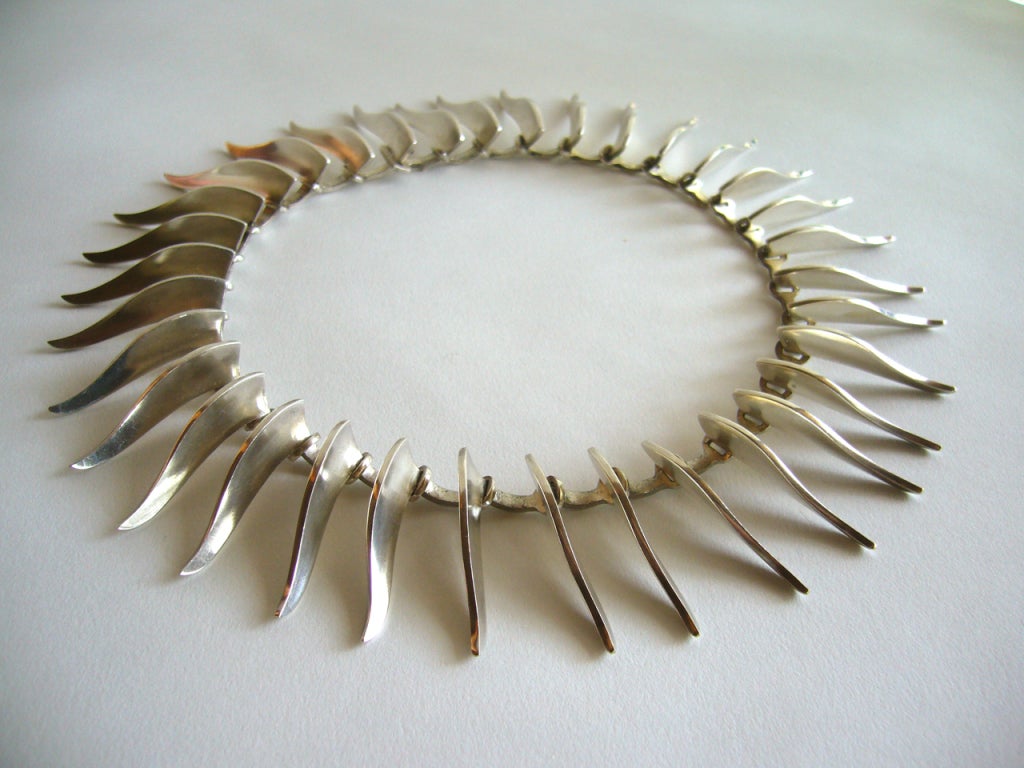 A sterling silver collar necklace by Danish designer Bent Knudsen of Denmark. Signed Bent K, Sterling, Denmark, 236.  It measures 15
