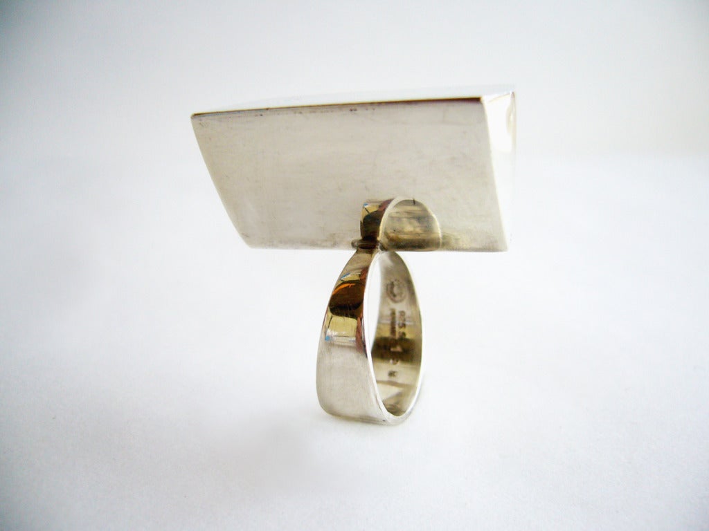 A rare, sterling ring designed by Astrid Fog for the Georg Jensen Silversmithy circa 1970's.  Off centered and with geometric hollow design, the ring stands 5/8