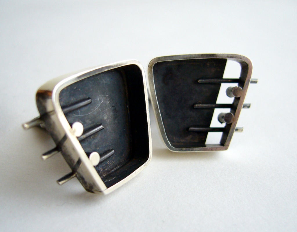 A pair of sterling silver shadow box style cufflinks by modernist jeweler Caroline Gleick Rosene of San Francisco, California.  Cufflinks measure 1
