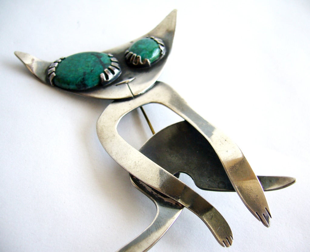 A rare, large scale handmade, one of a kind, sterling silver and malachite cat brooch created by Robert and Audrey Engstrom.  Brooch measures 4