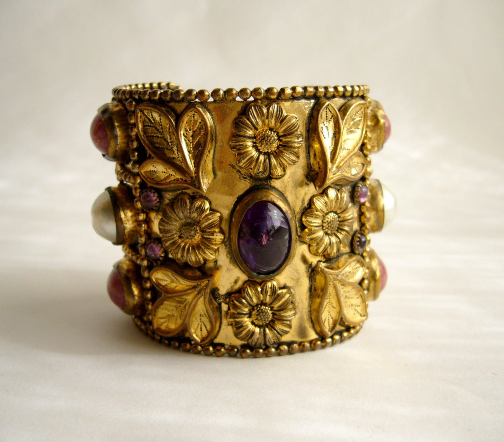 Large, golden Gripoix glass cuff bracelet with colors of coral, amethyst and pearl.  Cuff measures 2 3/8