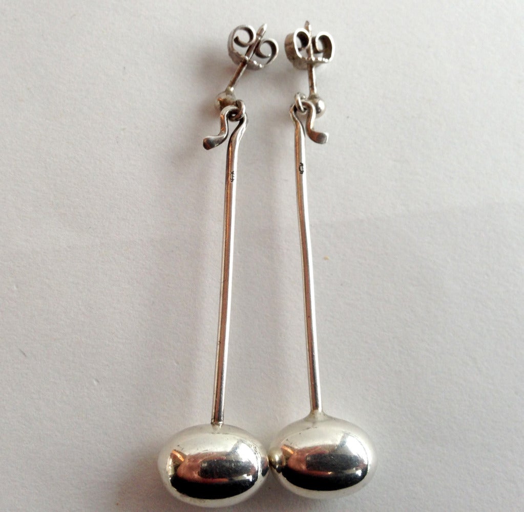 A pair of sterling silver oval bead earrings created by Vivianna Torun Bulow-Hube for Georg Jensen.  Earrings measure 2