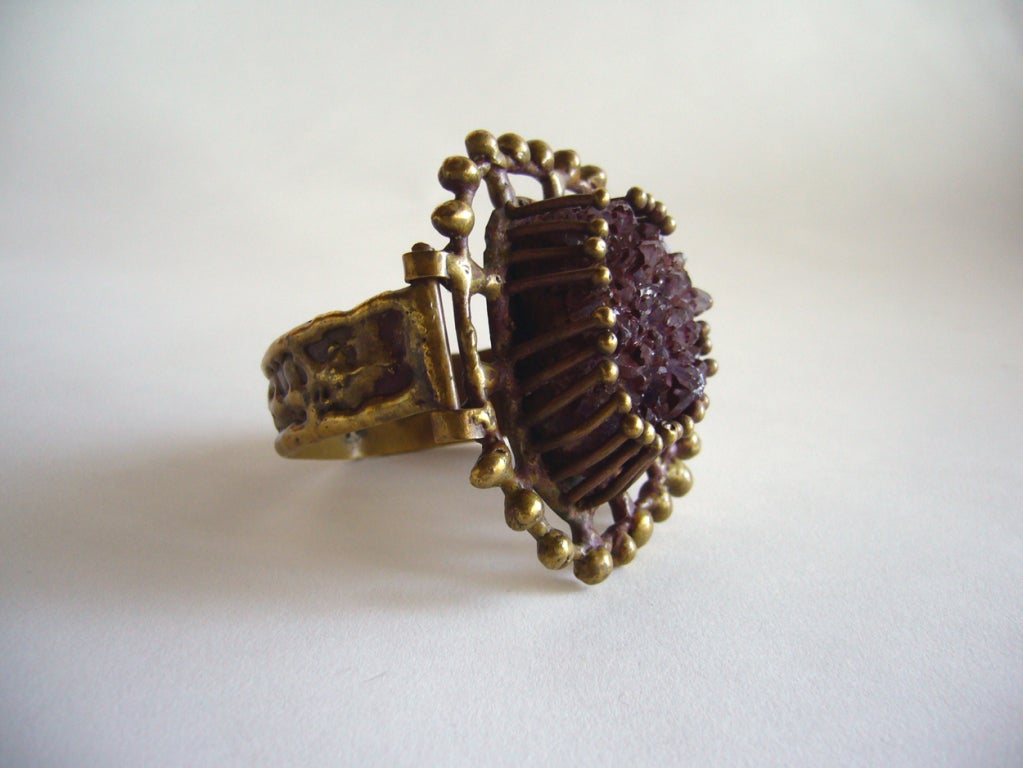 A bronze bracelet with large amethyst druzy quartz centerpiece by Pal Kepenyes of Acapulco, Mexico.  Kepenyes was born in Hungary and emigrated to Mexico in the 60's.  

Signed Kepenyes, this bracelet is a true one of a kind piece of art.

In