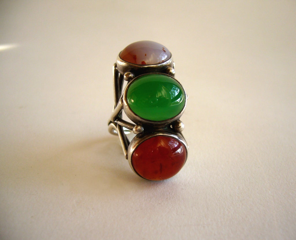 A rare and impressive chrysoprase and carnelian ring by H. Fred Skaggs of Scottsdale, Arizona.  Ring measures at 6 1/2 but will fit a size 7 comfortably due to the design. Signed Skaggs, Sterling and weighs 14.3 grams.  Excellent condition.