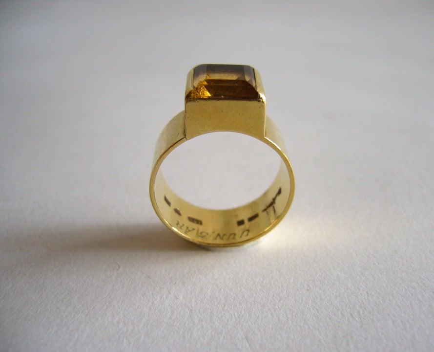 A rare Wiwen Nilsson 18k gold and single faceted citrine ring.  Wiwen Nilsson is one of Swedish design history's respected silversmiths who received worldwide acclaim for his innovative and highly characteristic geometric designs.  

This ring was