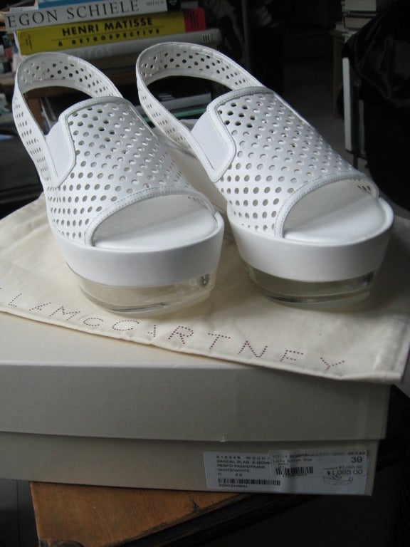 Stella McCartney White Sandals with Lucite Wedge Sizes 38 and 39 Original price $1095
In Original Box and Dust Bag