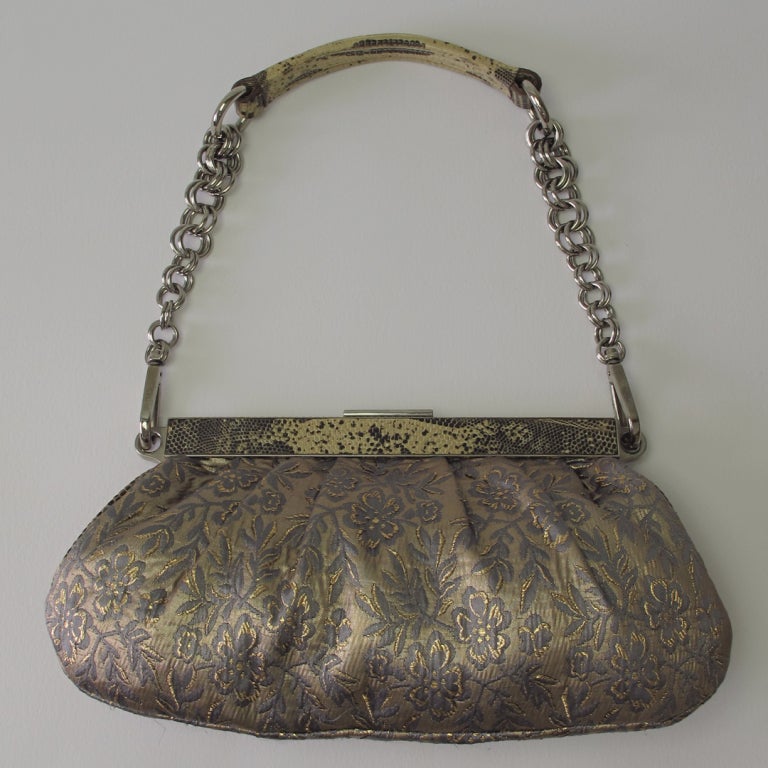 A Prada afternoon/evening bag from the 90s...Gorgeous brocade in blue and silvery gold...silver hardware, frame with applied snake skin, chain handle with handle top in padded snakeskin...bag is lined in pale pink leather, with one inside zipper