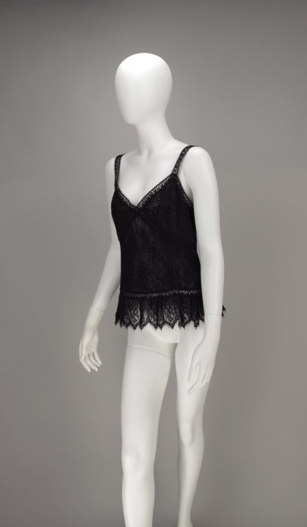 Black lace camisole top...perfect year round...panels of black lace are pieced together in a sexy design with lace edged hem...fully lined in black silk...closes at back with zipper and tiny black pearl button (hidden)...Marked size 40, measurements