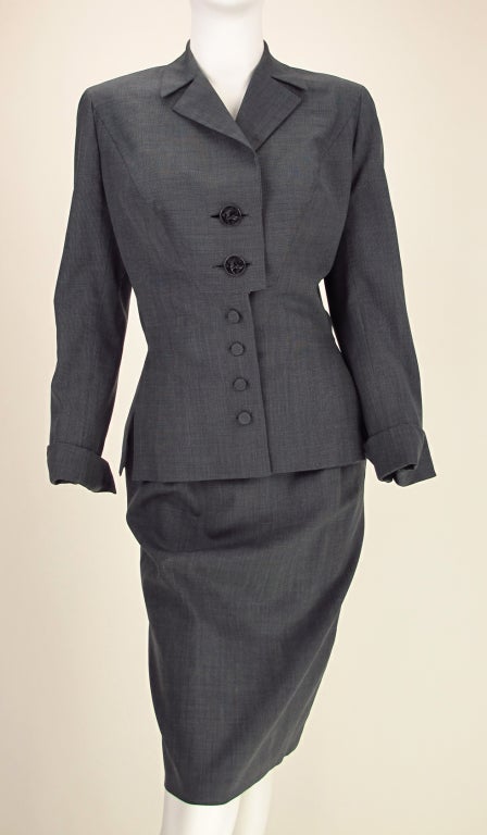 Irene, from the 1940s...light charcoal mini check, gray fine wool suit...loads of tailoring detail and great fit...The large top two buttons on the jacket are very detailed sterling silver Sphinx in relief, signed Michaud, the lower buttons are self
