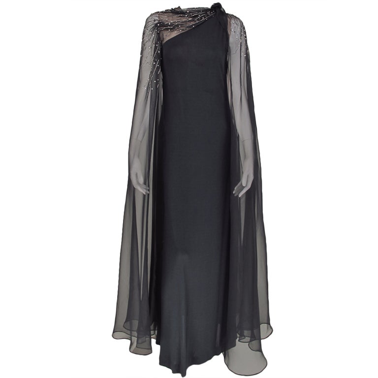 Mollie Parnis one shoulder cape sleeve gown 1970s