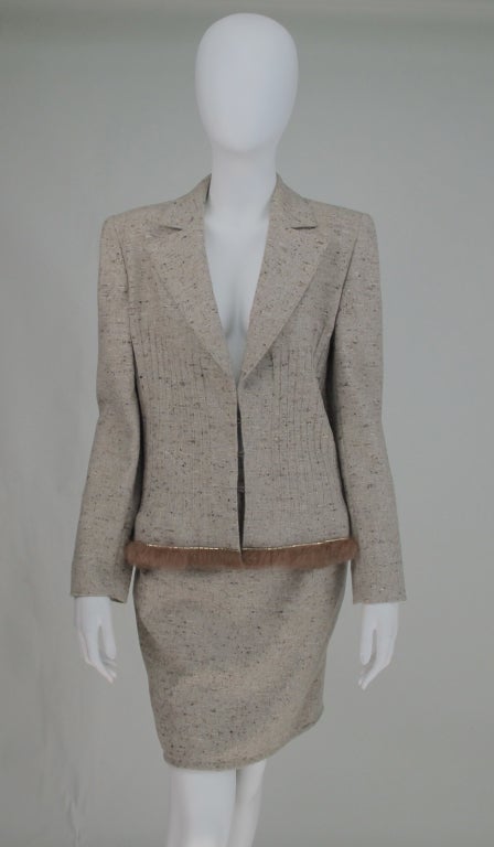 Uber chic cream tweed suit from Valentino Boutique...single breasted jacket with pin tucked fitted waist detail...jacket hem is trimmed with gold bar studs and fur...jacket closes with large hook & eyes and is fully lined in logo fabric...Short A