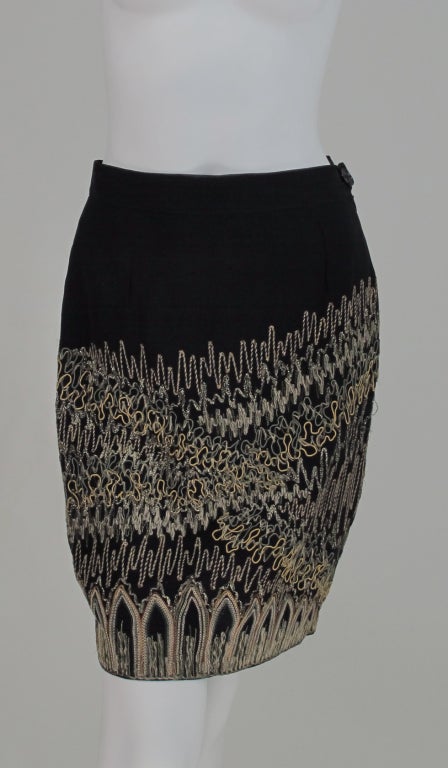 From  the 1990s,Gianfranco Ferre, black silk chiffon is heavily gold and silver embroidered in an abstract design that covers the lower 3/4 of this gorgeous skirt...Perfect for cocktails...fully lined in black...with fitted banded waist that closes