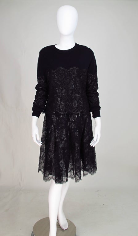 Bill Blass cashmere and metallic lace sweater set 1980s...Long sleeve cashmere sweater with lace applique, has ribbed neck hem and cuffs...Matching black silk satin skirt with lace overlay has open pleats and waist band that sits at natural waist,