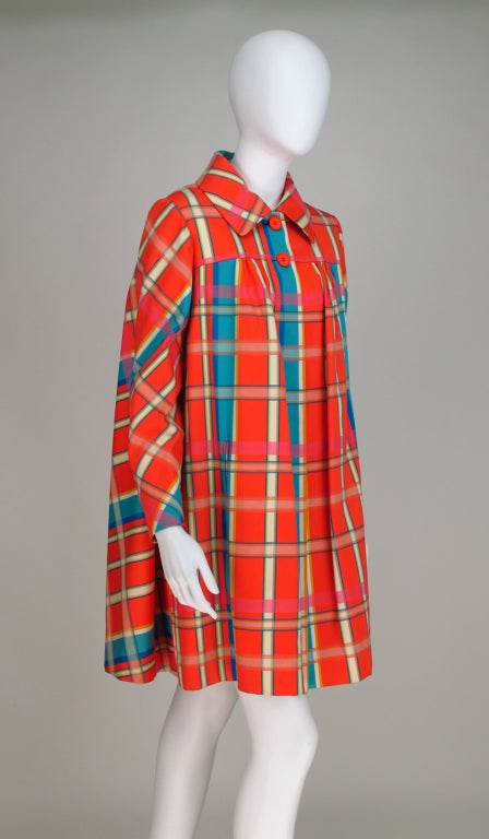 Mid 1960s Beene Bazaar tent/swing coat...Vibrant plaid tent/swing coat with a perfectly matched back diagonal design...Coat closes at front with two buttons and coat snaps, it is open below...Shoulder front yoke with light gathering below, there are