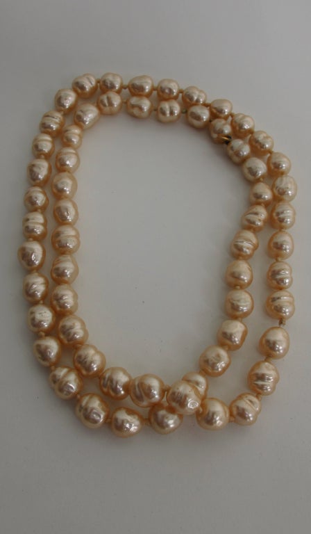 Chanel from  1981...Single strand of large champagne  baroque pearls...18