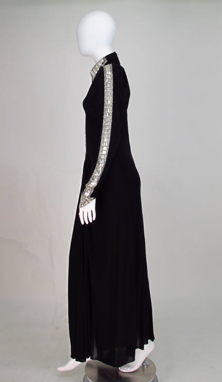 Make a spectacular entrance in this Karl Lagerfeld for Chloe black silk jersey gown...Old Hollywood starlet glamour sexy with the most amazing diamante detail in the arrows running down the long sleeves with pointed arrow head cuffs...The dress,